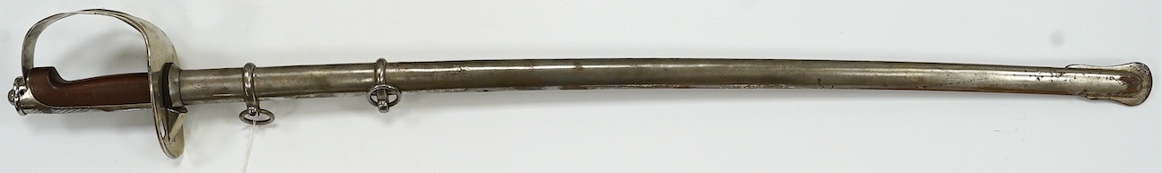 An Italian WWI cavalry trooper’s sword, pipe back blade, pierced guard, wooden grip, in its steel scabbard, blade 91cm. Condition - fair